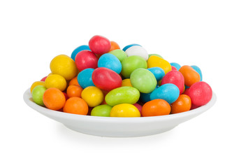 colored candies in white saucer