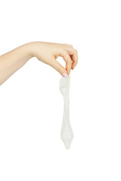 female hand holding a condom