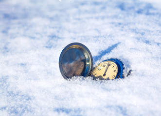 clock lying in the snow
