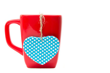 Red mug with heart shape isolated on white background