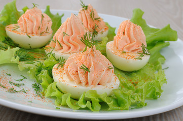 Eggs stuffed with salmon pate in lettuce leaves