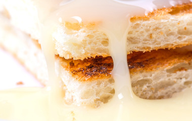 Bread toast and condensed milk for a snack