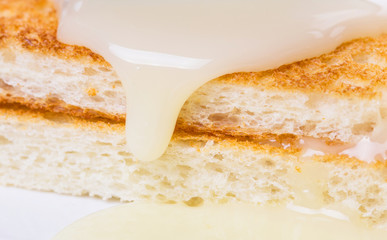 Bread toast and condensed milk for a snack