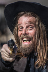 Cowboy Points Gun at You