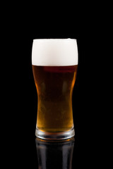 Glass of beer with beer head