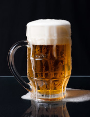 Overflowing beer glass