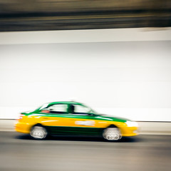 Fototapeta na wymiar Interior of an urban tunnel with car,motion blur
