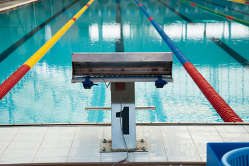 Interior of public indoor swimming pool with racing Lanes and bl
