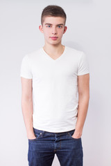 Obraz premium young casual man portrait, hands in pockets