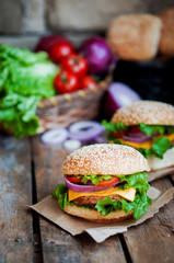 Closeup of home made burgers on wooden background
