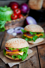 Closeup of home made burgers on wooden background