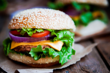 Closeup of home made burgers on wooden background