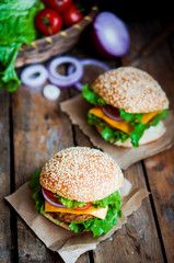 Closeup of home made burgers on wooden background