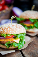 Closeup of home made burgers on wooden background