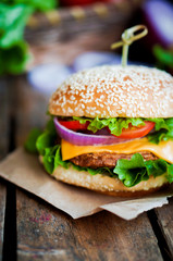 Closeup of home made burgers on wooden background