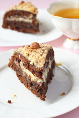 Fototapeta na wymiar Chocolate cake with nuts and tea