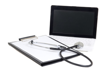 little laptop with blank screen, stethoscope and clipboard isola