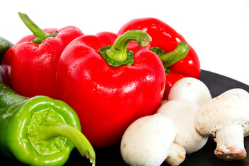 Closeup of peppers and mushrooms.