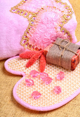 pink bath towel, natural soap, body scrubber