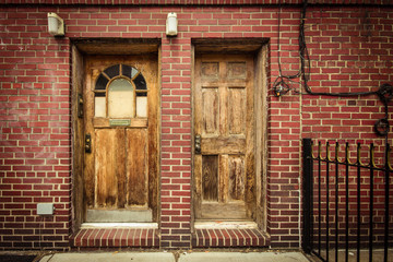 Double exterior doors on urban residential duplex