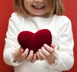 Valentine's Day - cute child with red Heart in hands