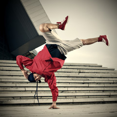 Breakdancer doing one hand stand