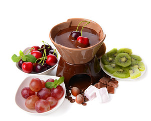 Chocolate fondue with marshmallow  and fruits, isolated on