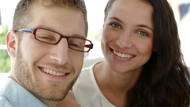 Portrait of attractive coworkers smiling at camera