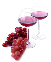 Wineglasses with red wine, grape isolated on white
