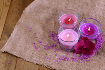 Composition with beautiful colorful candles, sea salt and