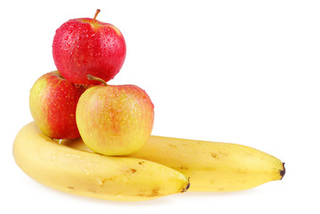 Naklejka na ściany i meble Dewy apples and bananas on a white background