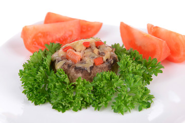 Stuffed mushrooms on plate isolated on white