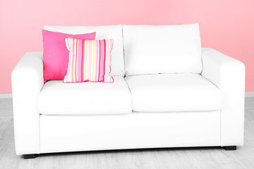 White sofa in room on pink background