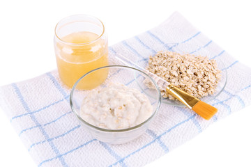 Homemade facial mask with oats and honey, isolated on white
