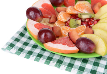 Sweet fresh fruits on plate on table close-up