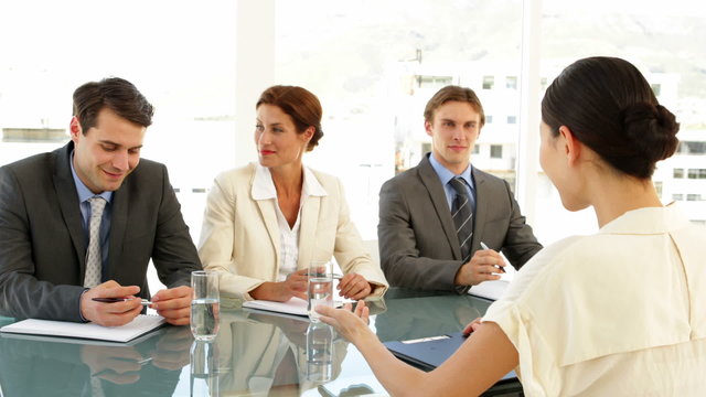 Businesswoman being interviewed by panel