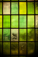 green glass window with regular block pattern green tone
