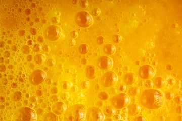 Diet nutrition. Fresh yellow fruits juice background texture