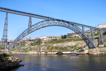 Fototapeta na wymiar One of the several bridges over Douro river in Porto, Portugal