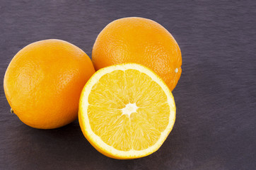 Orange fruits on slate