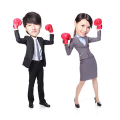 Business man and woman win pose with boxing gloves