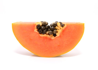 Half cut and whole papaya fruits on white background