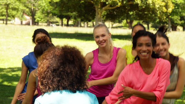 Zumba class dancing in the park