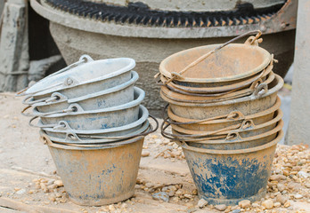 Fototapeta premium Plastic buckets for transport of cement at construction site