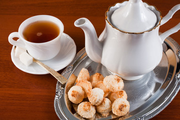 tea, teapot and coconut cookies