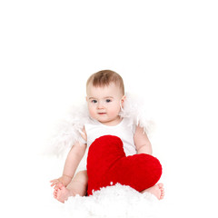 Portrait of little valentine angel with red soft heart