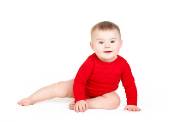 Portrait of a little girl sitting on a white background