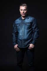 Obraz premium Casual winter fashion man. Wearing blue jeans shirt and trousers