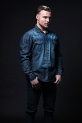 Fototapeta premium Casual winter fashion man. Wearing blue jeans shirt and trousers