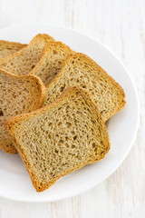 toasts on plate on white background